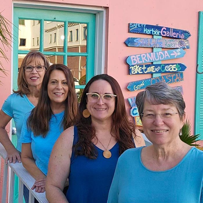 Four members of the Safety Harbor Galleria team posing in front of the boutique